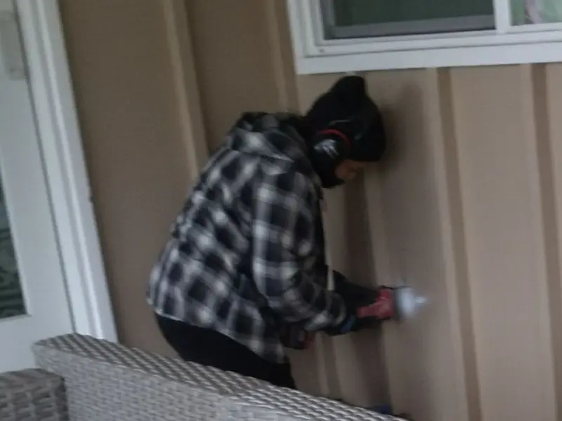 Professional electrician installing an exterior outlet in Hanford