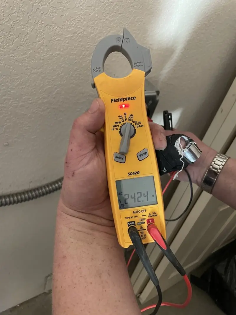 Voltage testing with clamp meter during Recessed Lighting Installation in Hanford